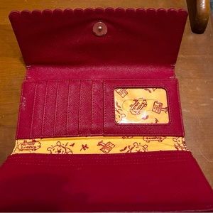 Winnie the Pooh Wallet from Disney World Park. Slightly used.